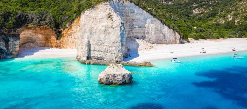 Turquoise water and white cliffs at a stunning beach in Greece, one of the best beach destinations in the world