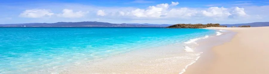 Playa de Rodas boasts crystal-clear blue waters and soft white sands on the Cíes Islands.