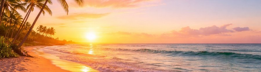 Sunrise over the ocean with palm trees and gentle waves on a Southern California beach