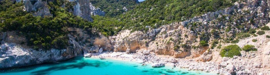 Cala Goloritzè beach in Sardinia with turquoise water and limestone cliffs