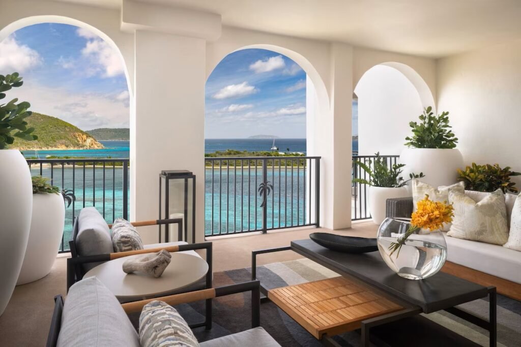 Ocean view terrace at The Ritz-Carlton St thomas with seating area, arched architecture, and views of turquoise water