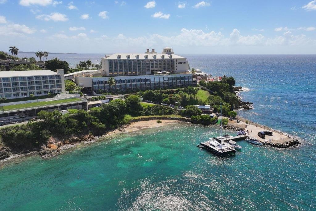 Aerial view of The Westin St thomas Beach Resort & Spa overlooking turquoise water and a small beach cove