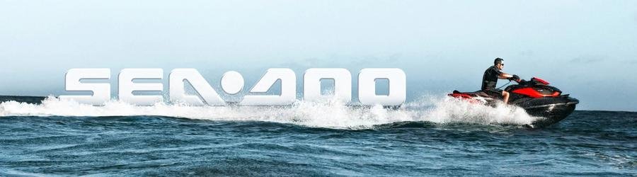 Sea-Doo jet ski racing across the ocean with large logo splash in the background.
