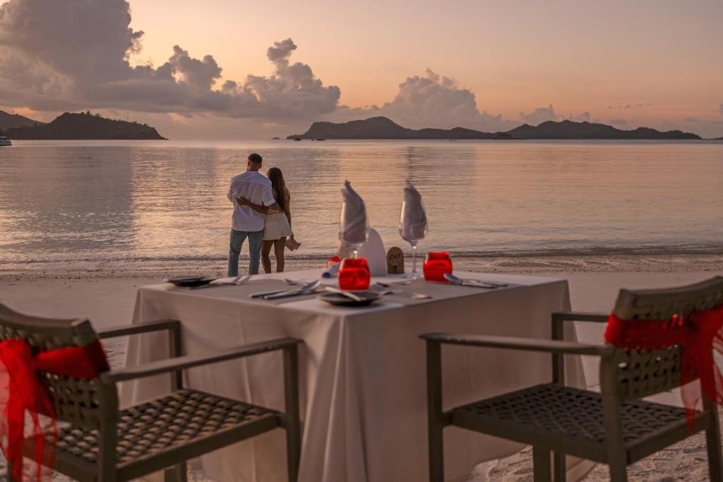 Romantic beach dinner setup at Hotel L’Archipel Praslin Island