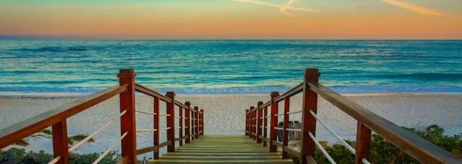 wooden boardwalk leading to the beach at sunset in Cayo Largo Cuba