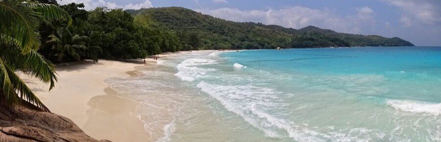Anse Lazio beach with waves and turquoise water Praslin Island Seychelles