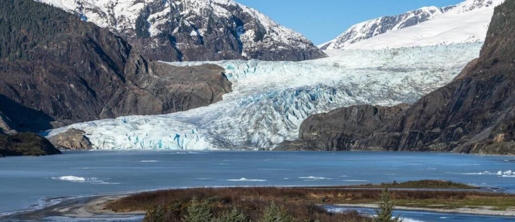 Mendenhall Glacier in Juneau Alaska | Beach Travel Destinations Mendenhall Glacier surrounded by mountains near Juneau, Alaska