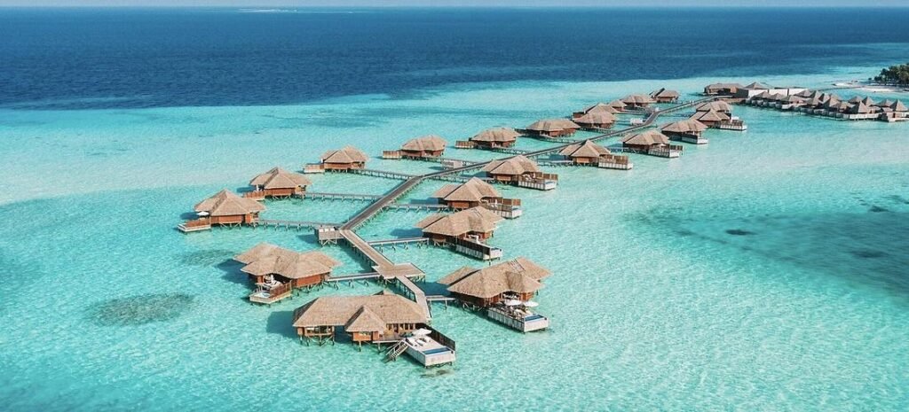 Best of the Maldives; Overwater villas in the Maldives surrounded by turquoise lagoon and white sand beaches
