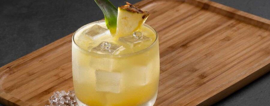 Traditional Pisco Punch cocktail served over ice with a pineapple garnish in San Francisco.