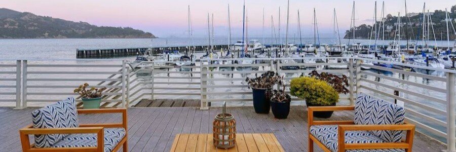 Outdoor waterfront deck at Water's Edge Hotel overlooking the marina in Tiburon.