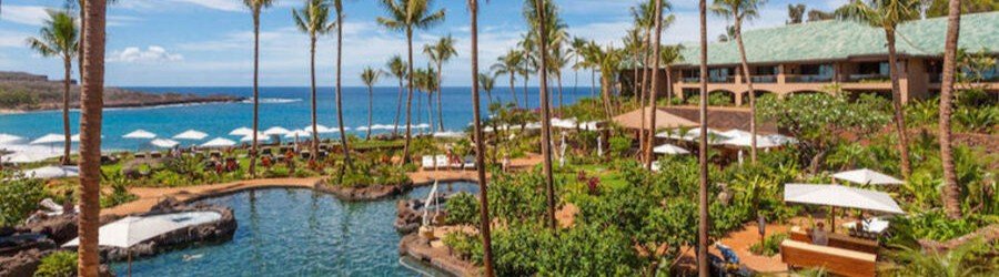 Lagoon-style swimming pool surrounded by tropical botanical gardens at Four Seasons Resort Lanai