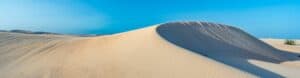This image has an empty alt attribute; its file name is Corralejo-Dunes-300x78.jpg