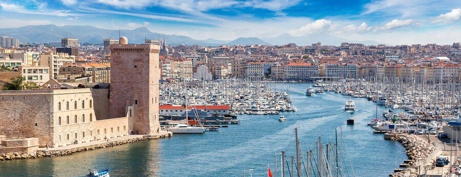 Old Port harbor in Marseille France with Fort Saint Jean marina boats and Mediterranean waterfront skyline