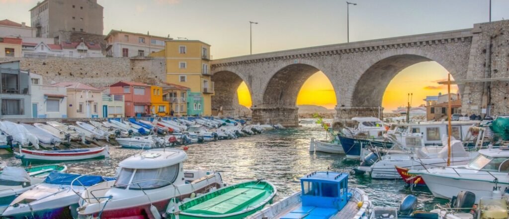 Vallon des Auffes harbor in Marseille France with fishing boats stone bridge and colorful coastal houses