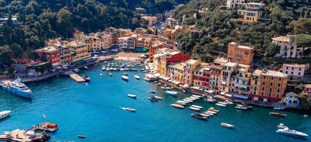 Aerial view of Portofino harbor with boats and colorful waterfront buildings