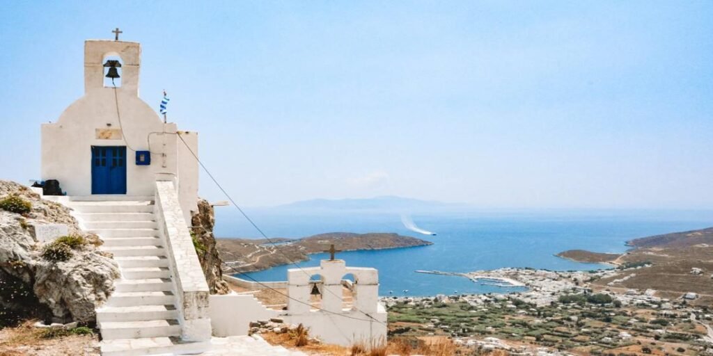 Beautiful Serifos Greece with a white chapel overlooking the Aegean Sea and the town below.
