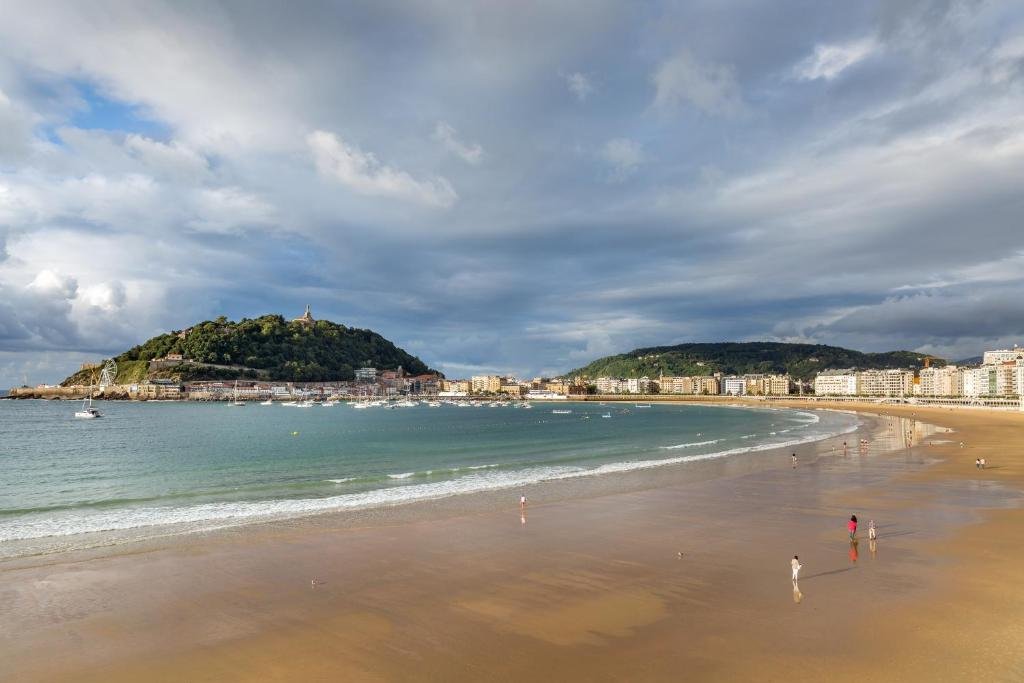 La Concha Beach view near Room Mate Collection Gorka with wide shoreline and bay