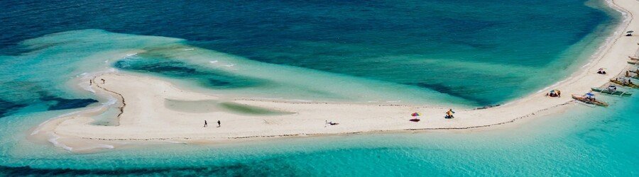 Aerial view of a white sandbar surrounded by turquoise water in the Philippine Islands