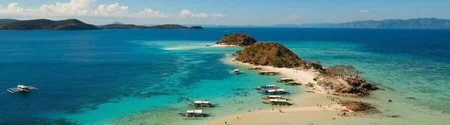 Banana Island Coron with white sand beach and clear blue water