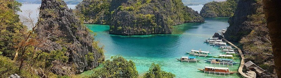 Banul Beach in Coron with limestone cliffs and turquoise water