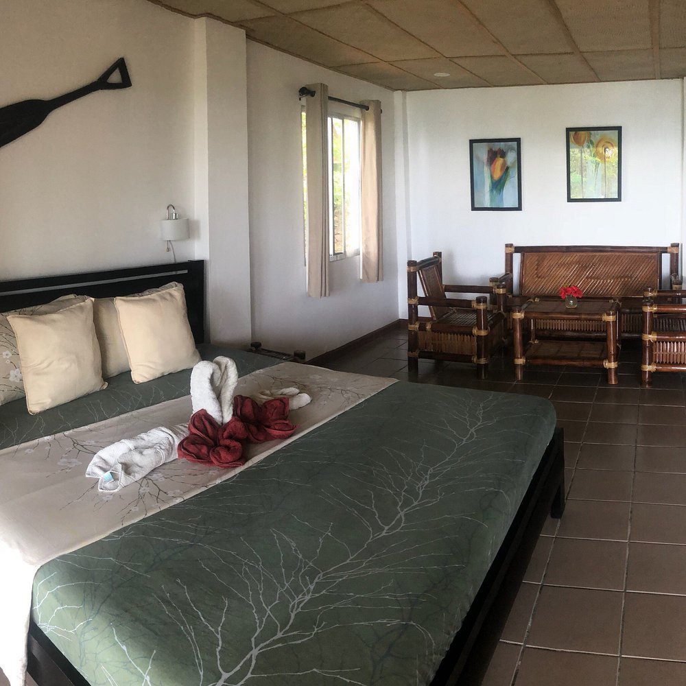 Guest room interior at Chindonan Dive Resort with bamboo furniture and simple design