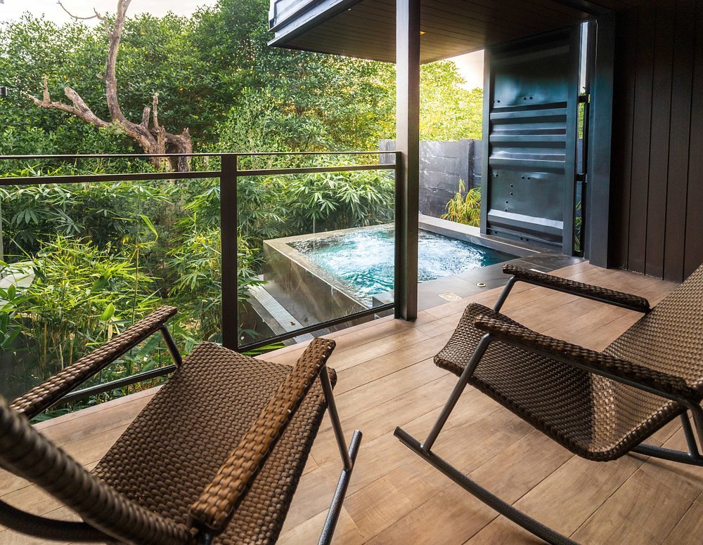 Private plunge pool terrace at The Funny Lion Coron surrounded by greenery