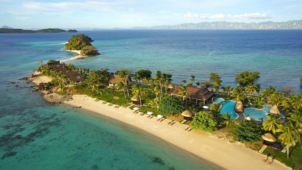 Two Seasons Coron Island Resort & Spa on a private island with white sand beach and turquoise water