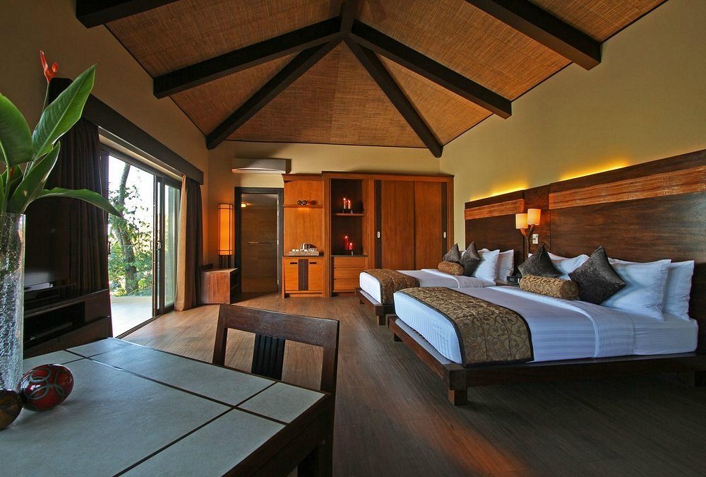 Interior of a villa at Two Seasons Coron Island Resort with wood accents and tropical design