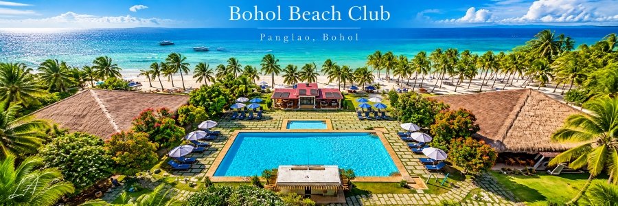Aerial view of Bohol Beach Club in Panglao, featuring a turquoise swimming pool, tropical palm trees, thatched pavilions, and a white-sand beach.