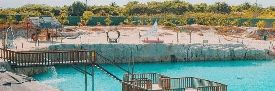 Turquoise waters of Buraco Azul Caiçara near Jericoacoara with viewing platforms and relaxing areas.