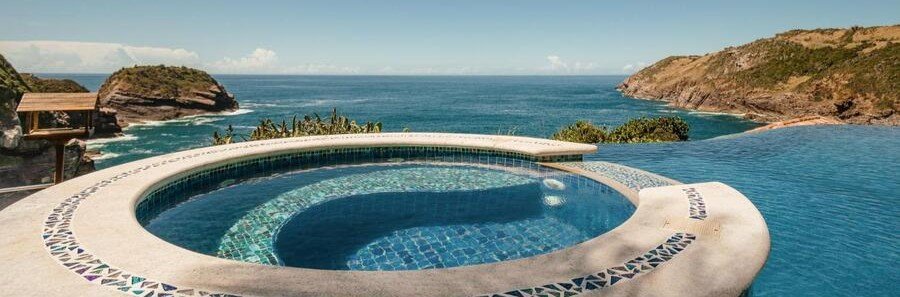 Infinity Pool at Cliffside Luxury Inn in Búzios | Beach Travel Destinations Infinity pool overlooking dramatic cliffs and the Atlantic Ocean at Cliffside Luxury Inn in Búzios.