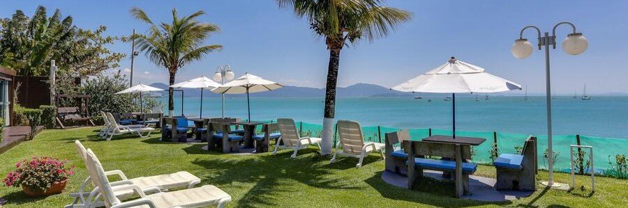 Hotel Sete Ilhas Beachfront Gardens | Beach Travel Destinations Beachfront gardens and ocean views at Hotel Sete Ilhas on Jurerê Beach in Florianópolis.