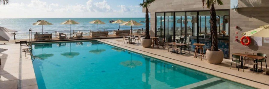 Ibis Styles Maragogi Pool and Beachfront View | Beach Travel Destinations Pool area at Ibis Styles Maragogi overlooking the beach and ocean in Maragogi, Brazil