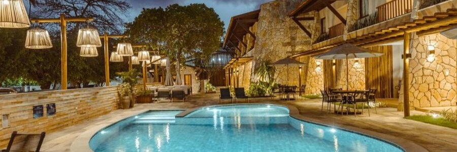 Evening view of the pool and illuminated courtyard at Maihai Porto de Galinhas in Pernambuco, Brazil.