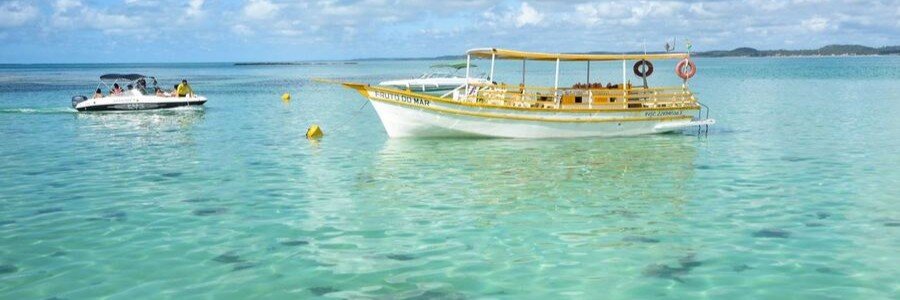 Boat Tour in Maragogi | Beach Travel Destinations Boats floating in clear turquoise water during a Maragogi boat tour in Brazil