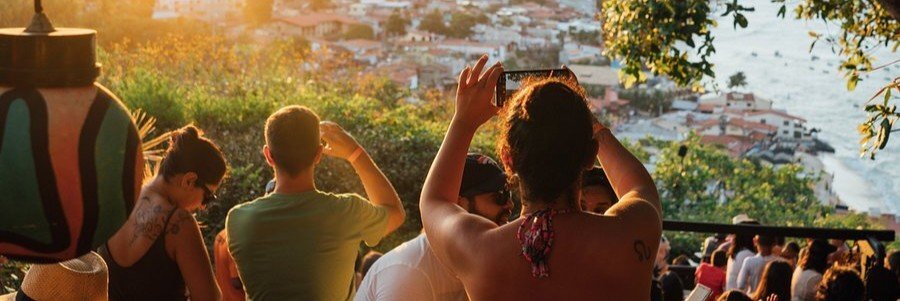 People enjoying sunset views over Praia da Pipa from Mirante Sunset Bar.