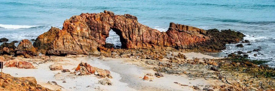 Pedra Furada rock arch on the coastline in Jericoacoara National Park, Brazil.
