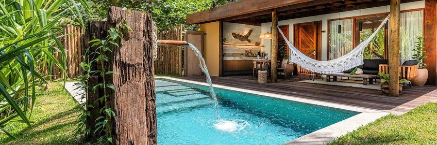 Private Pool Suite at Pousada Camurim Grande | Beach Travel Destinations Private pool suite at Pousada Camurim Grande surrounded by tropical greenery in Maragogi, Brazil