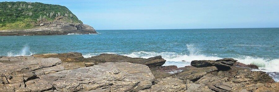 Praia da Foca Rocky Coast in Búzios | Beach Travel Destinations Rocky shoreline and crashing waves at Praia da Foca in Búzios, Brazil.