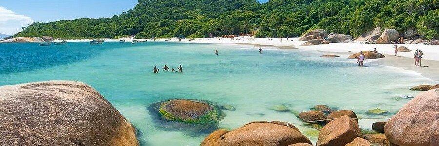 Praia do Gravatá Beach Florianopolis | Beach Travel Destinations Crystal-clear turquoise water and white sand at Praia do Gravatá in Florianópolis.