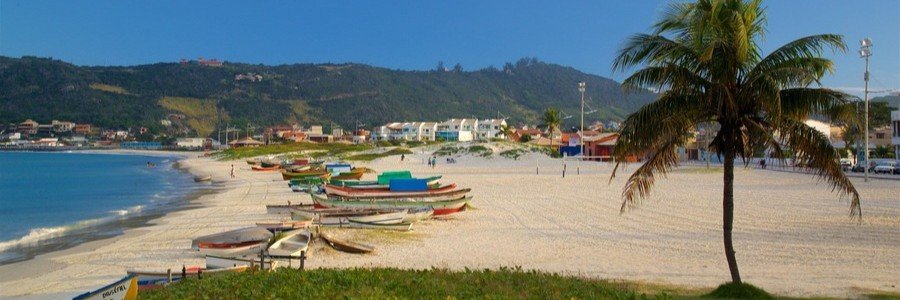 Beautiful Beach in Búzios Brazil | Beach Travel Destinations Fishing boats resting on the white sand of a beautiful beach in Búzios, Brazil.