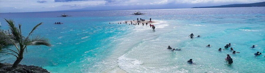Sumilon Island sandbar in Cebu with white sand and shallow turquoise water
