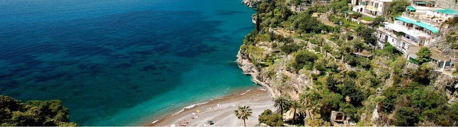Arienzo Beach in Positano Italy with turquoise water and a quiet pebbled shoreline below coastal cliffs