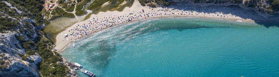 aerial view of Cala Luna Beach with curved shoreline