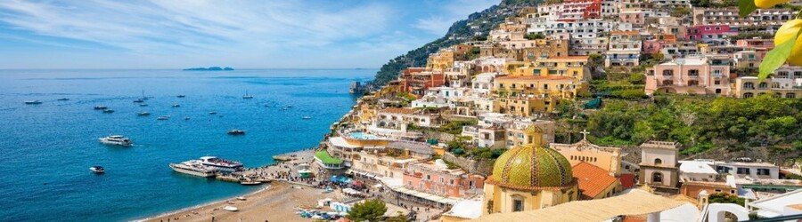 Positano Italy hillside village with pastel buildings overlooking the Mediterranean Sea