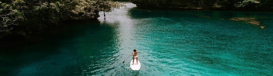 Paddleboarding on a clear lagoon in Siargao