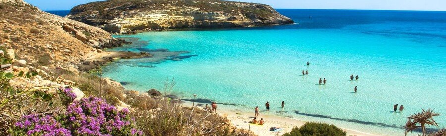 Turquoise waters and soft sand at Spiaggia dei Conigli beach in Lampedusa, Italy