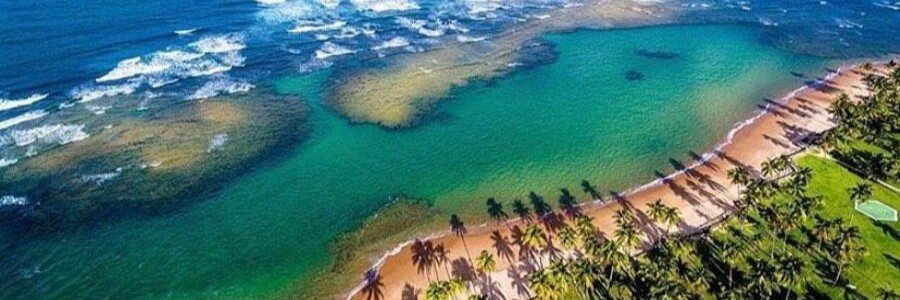 Aerial view of the natural pools and turquoise waters at Taipu de Fora on the Maraú Peninsula in Bahia, Brazil.