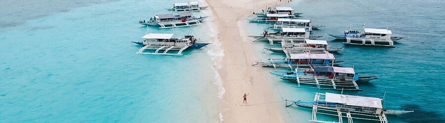 Boats anchored along the sandbar on Malapascua Island