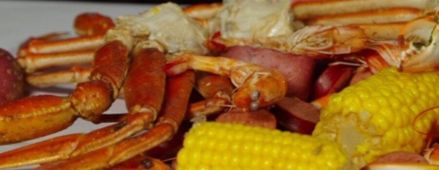 Cajun seafood boil with crab legs, shrimp, sausage, and corn at The Boiling Pot in Rockport Texas.